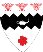 Device: Argent, on a fess indented sable between three bees and a cherry blossom gules, an Arabian lamp lit argent. (July 2018)